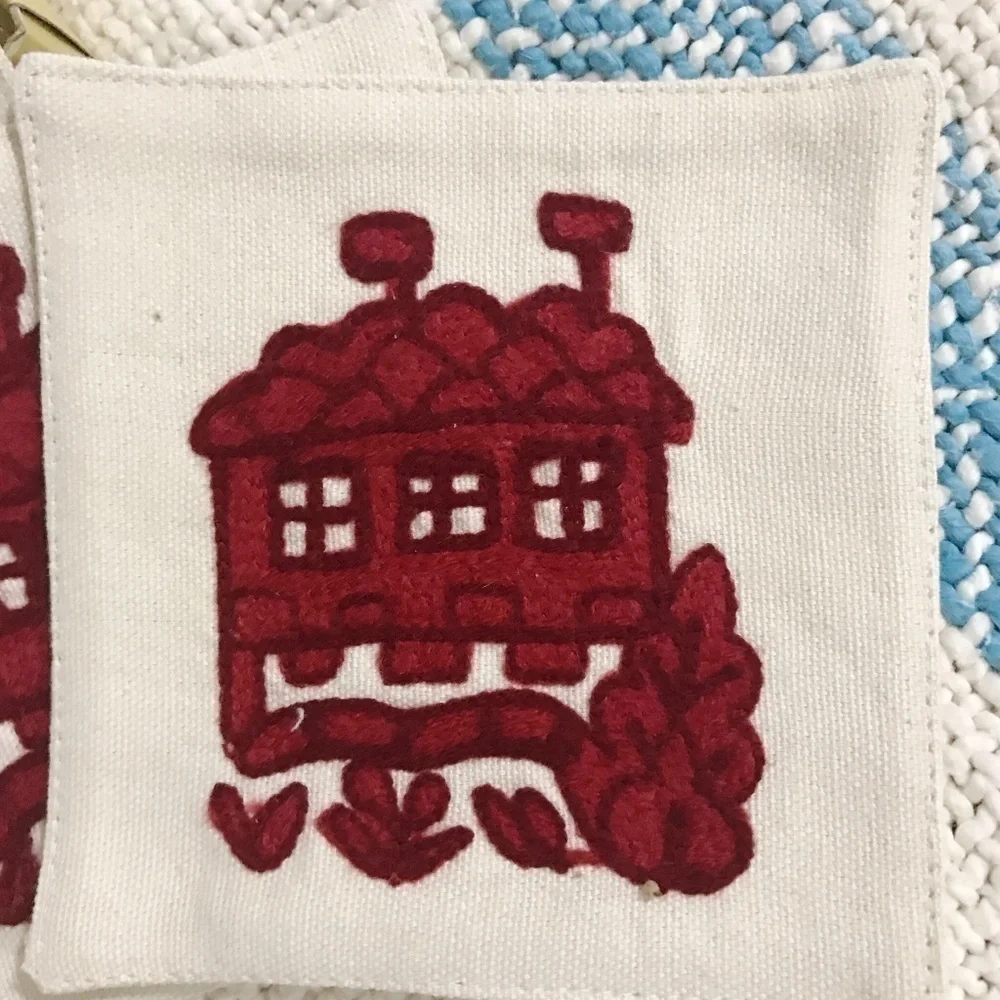 Williams Sonoma hand stitched crewel coaster set